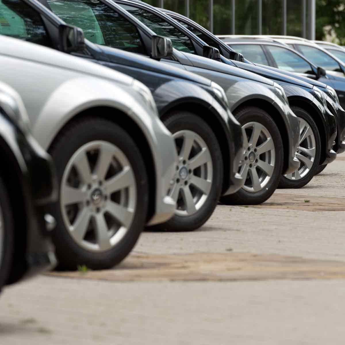 A row of inspected cars parked at a Sawa lot in Kigali